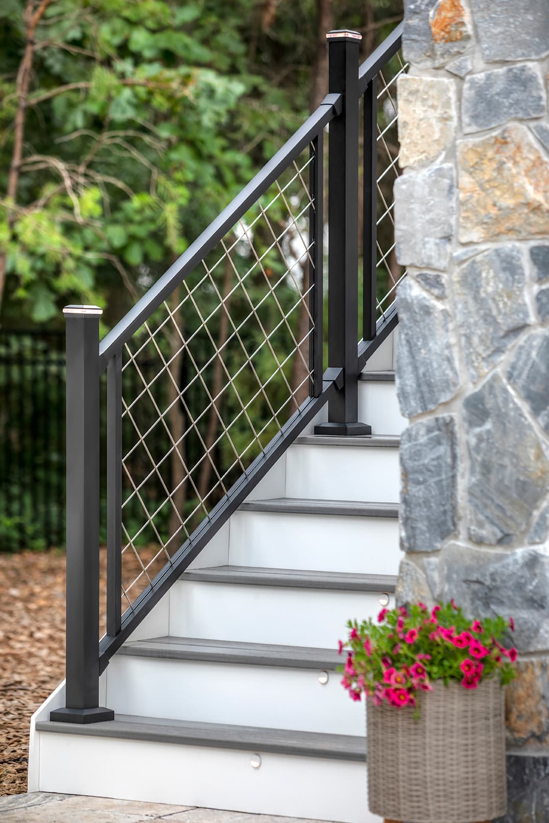 Trex Transcend Island Mist decking with glass and mesh railing